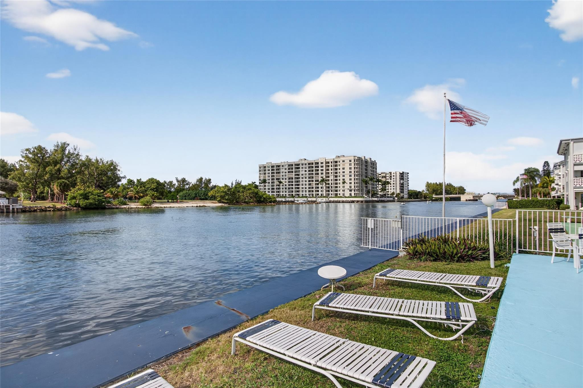 1001 North Riverside Drive, Unit 305 Pompano Beach, FL 33062 - Photo 32 of 44 a view of a balcony with a floor to ceiling window and wooden floor