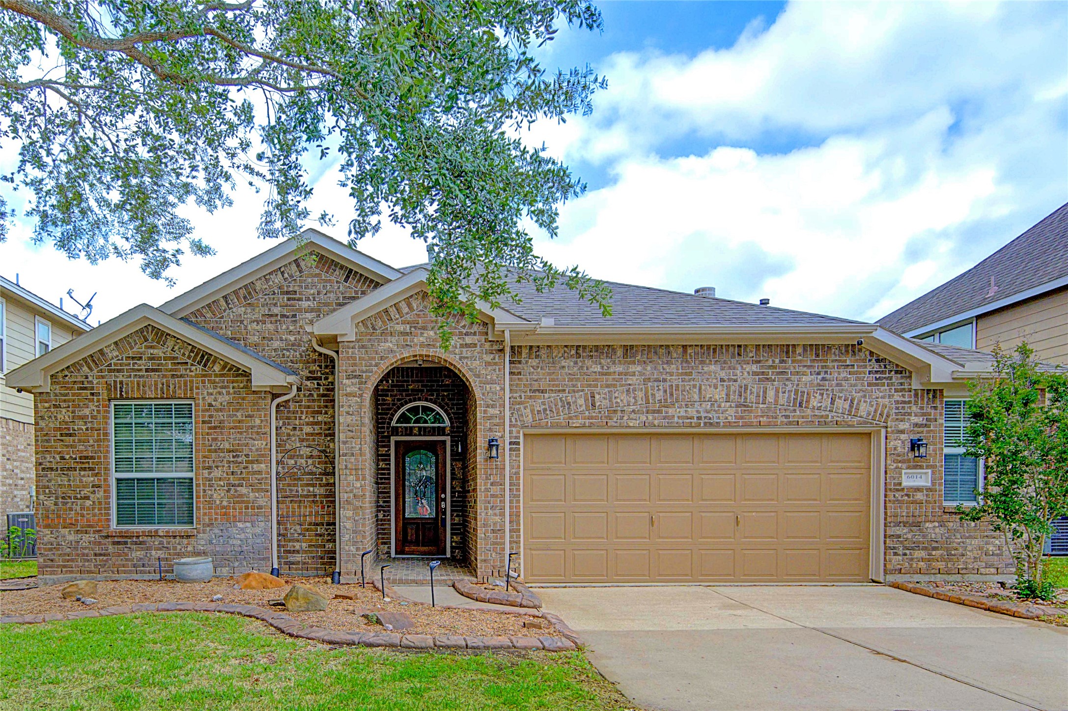 01 – Charming brick exterior with covered entry and great curb appeal.