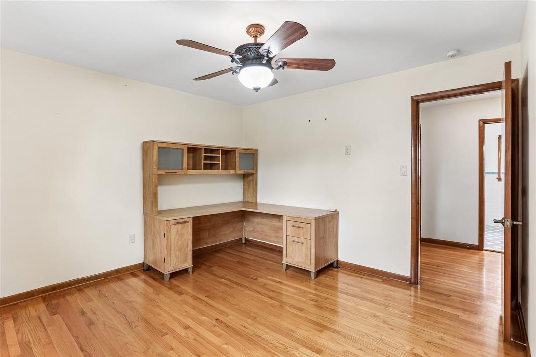 3659 Ironstone Road Bethlehem, PA 18020 - Photo 25 of 52 A well-appointed office space features gleaming hardwood floors and a functional corner desk setup.