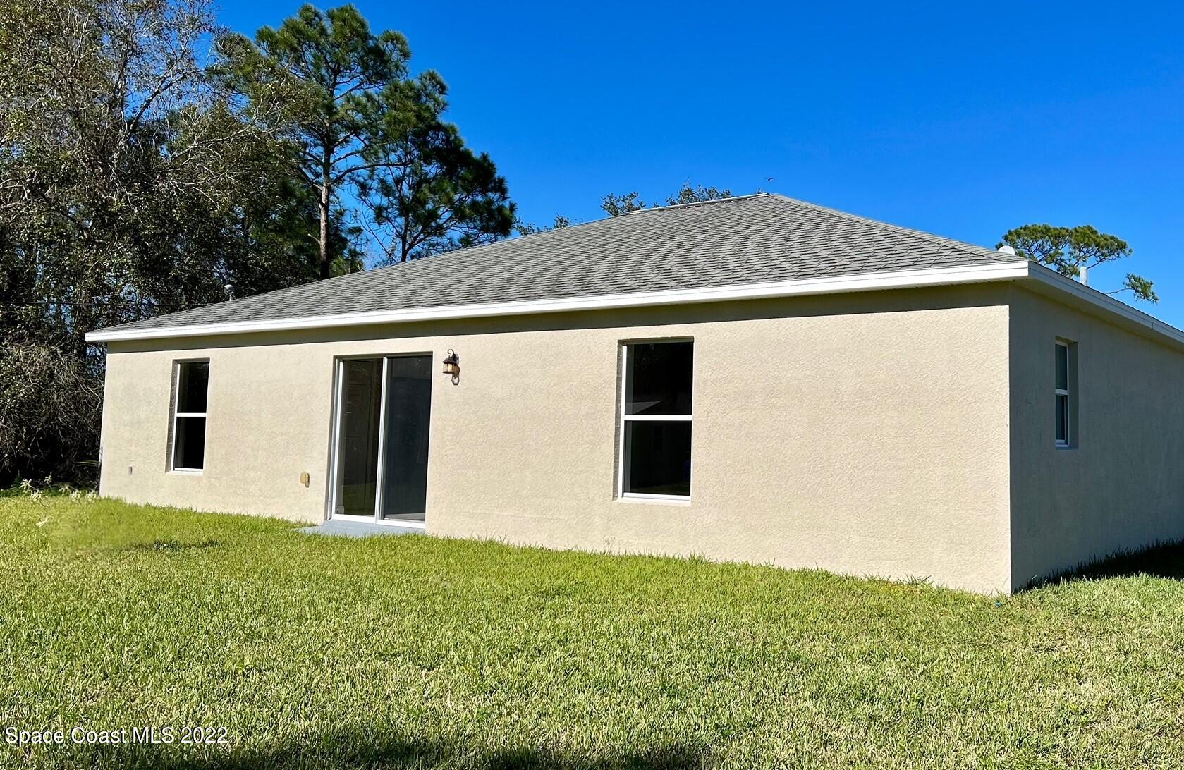 718 Andrew Street Southeast Palm Bay, FL 32909 - Photo 3 of 11 Exterior Rear