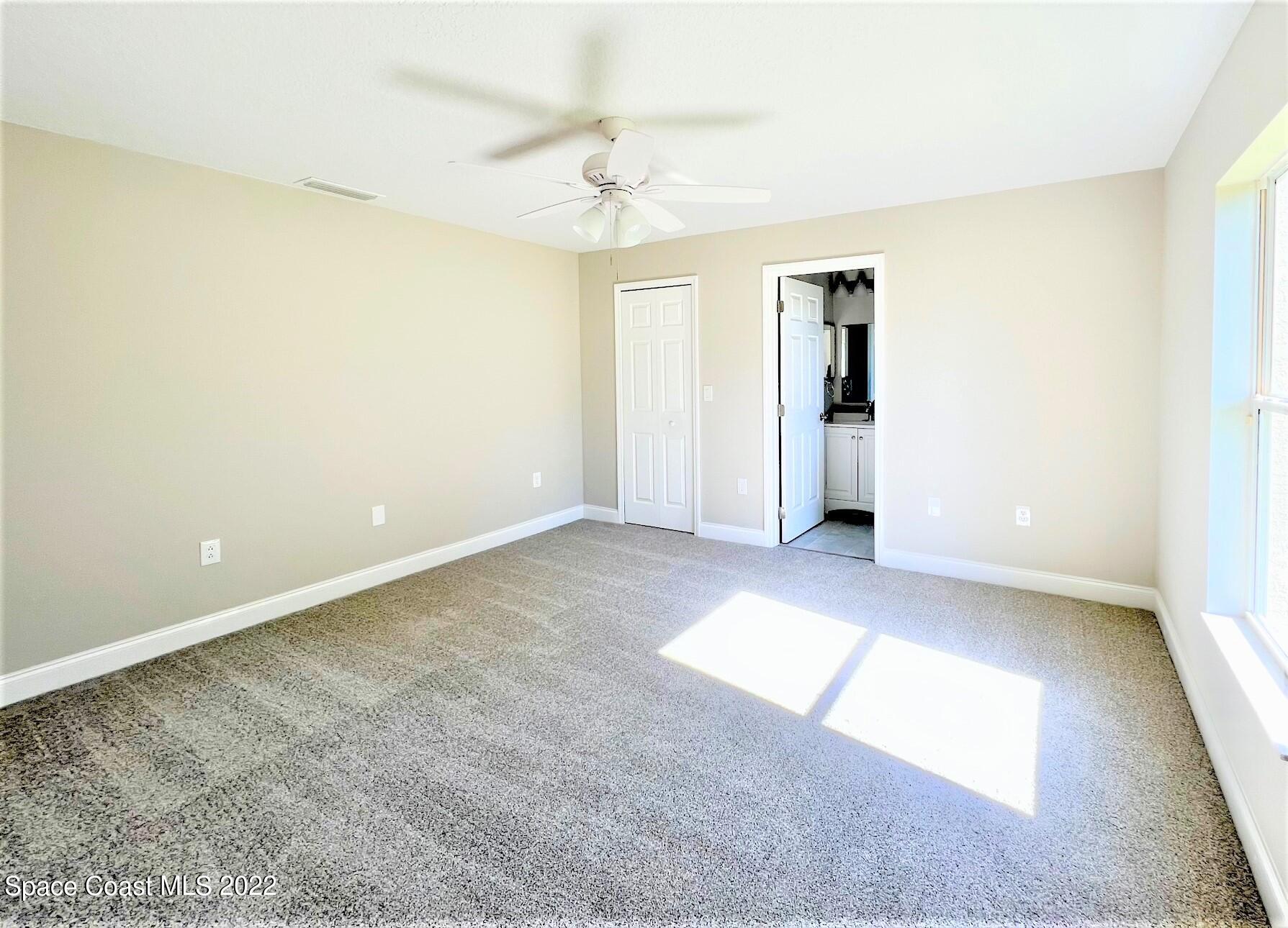 718 Andrew Street Southeast Palm Bay, FL 32909 - Photo 8 of 11 Master Bedroom