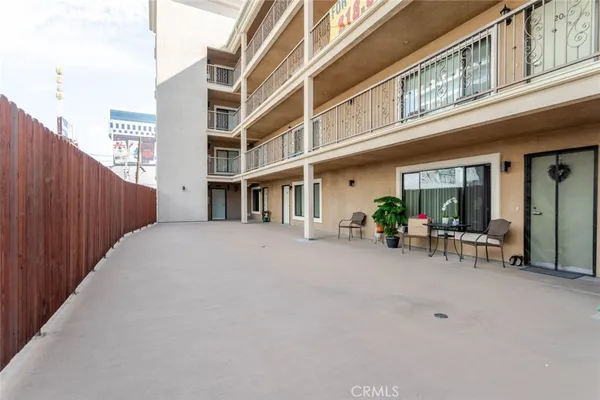 a view of a building with sitting area