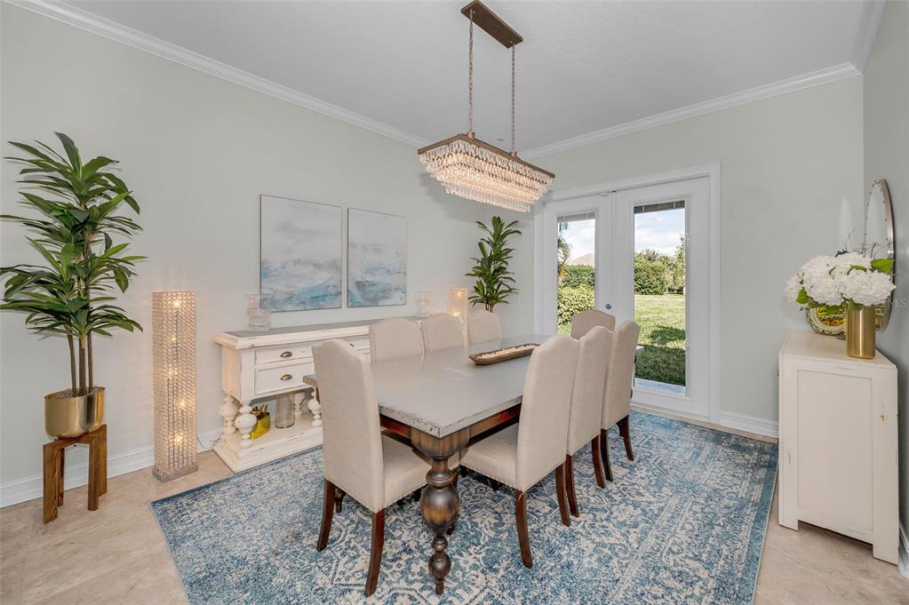 9952 Sago Point Drive Largo, FL 33777 - Photo 12 of 44 a view of a dining room with furniture window and wooden floor