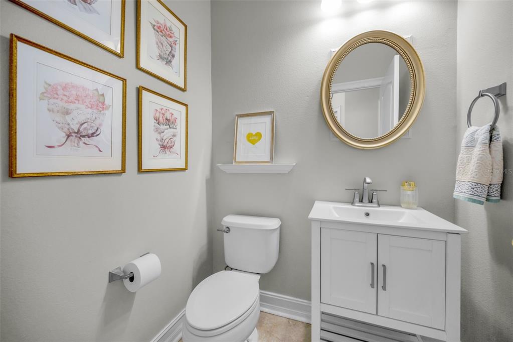 9952 Sago Point Drive Largo, FL 33777 - Photo 14 of 44 a bathroom with a toilet a sink and a mirror