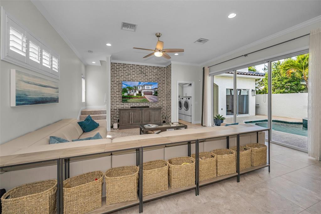9952 Sago Point Drive Largo, FL 33777 - Photo 16 of 44 a bathroom with a double vanity sink a mirror and a bathtub