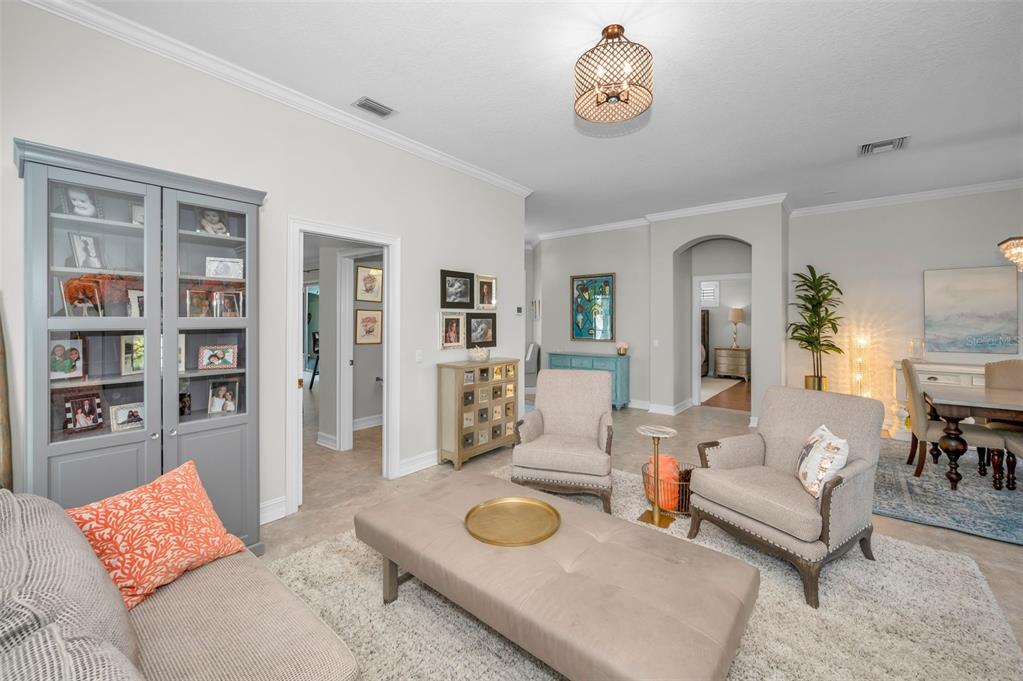 9952 Sago Point Drive Largo, FL 33777 - Photo 18 of 44 a living room with furniture and a table