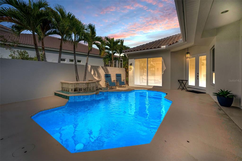 9952 Sago Point Drive Largo, FL 33777 - Photo 2 of 44 a view of a living room with a swimming pool