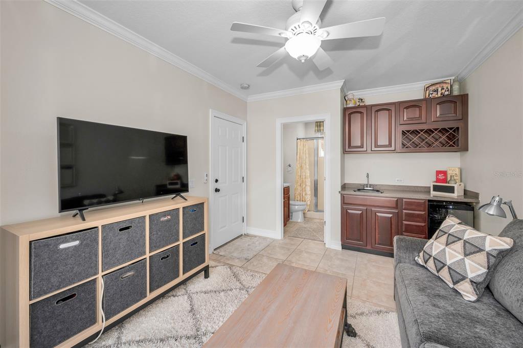 9952 Sago Point Drive Largo, FL 33777 - Photo 28 of 44 a living room with furniture and a flat screen tv