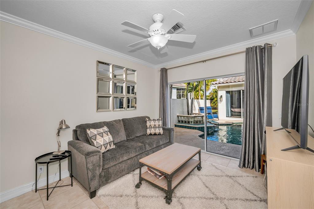 9952 Sago Point Drive Largo, FL 33777 - Photo 29 of 44 a living room with furniture and a large window