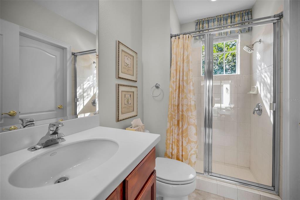 9952 Sago Point Drive Largo, FL 33777 - Photo 30 of 44 a bathroom with a sink toilet and shower