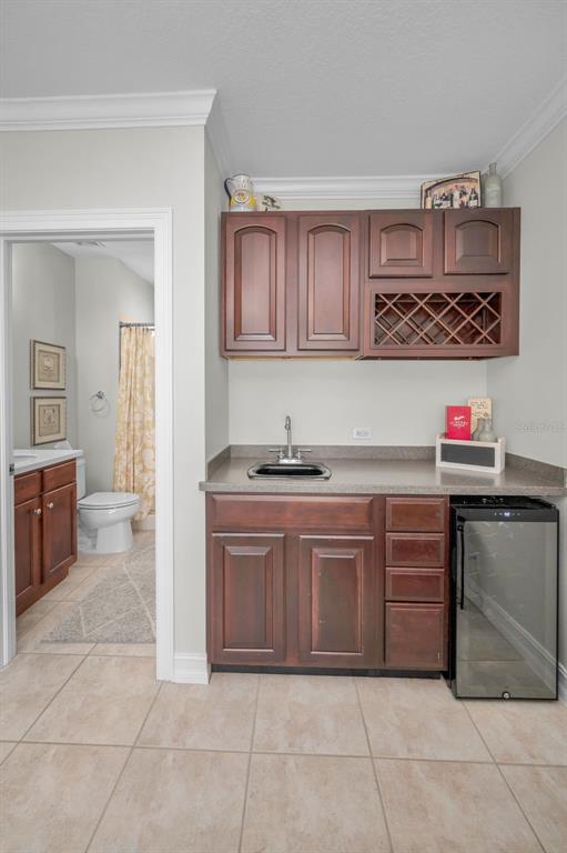 9952 Sago Point Drive Largo, FL 33777 - Photo 31 of 44 a kitchen with granite countertop a sink and cabinets