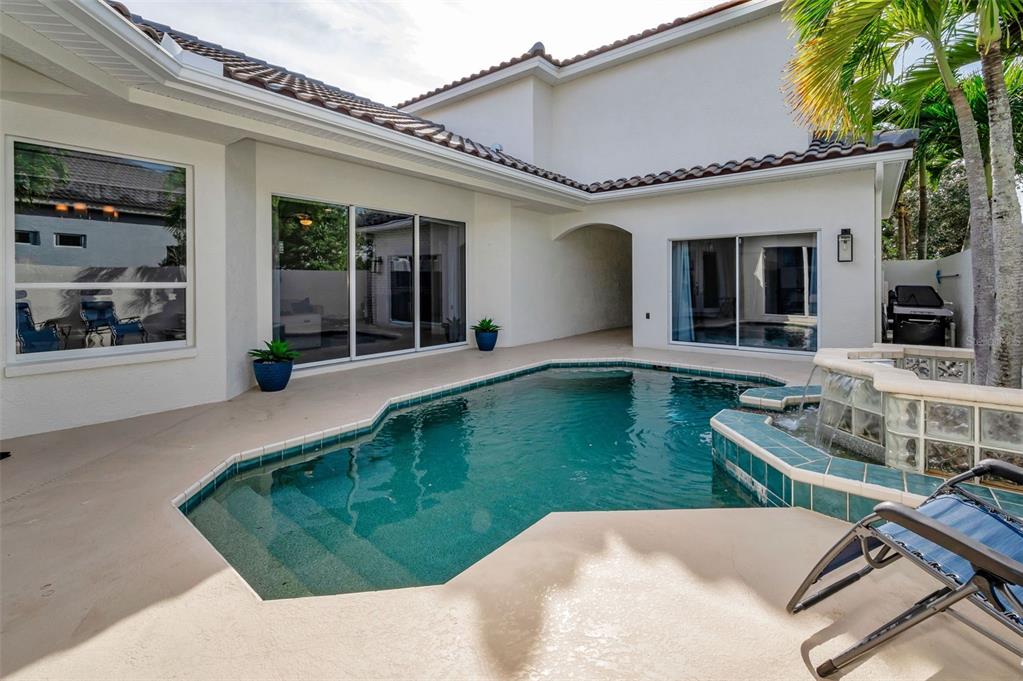 9952 Sago Point Drive Largo, FL 33777 - Photo 33 of 44 front view of a house with a yard