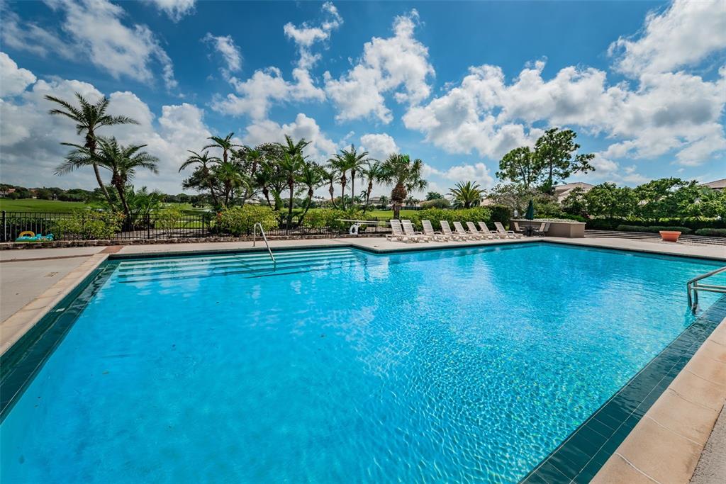 9952 Sago Point Drive Largo, FL 33777 - Photo 39 of 44 a view of a swimming pool and an outdoor seating