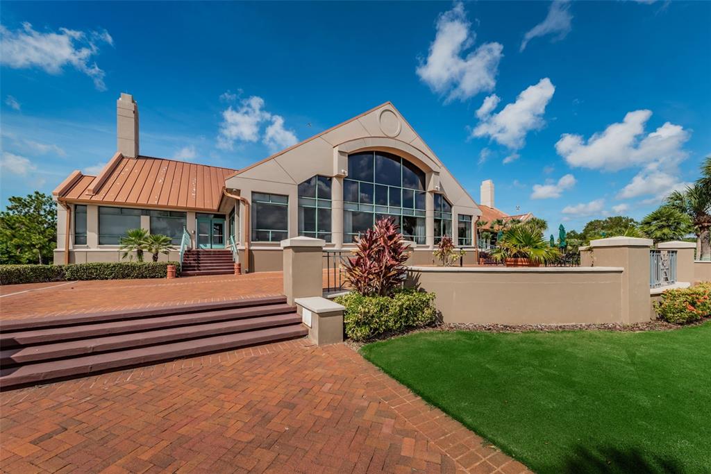 9952 Sago Point Drive Largo, FL 33777 - Photo 42 of 44 a front view of a house with a yard