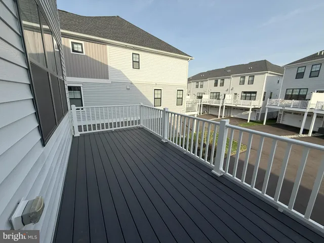 a view of a balcony with wooden floor