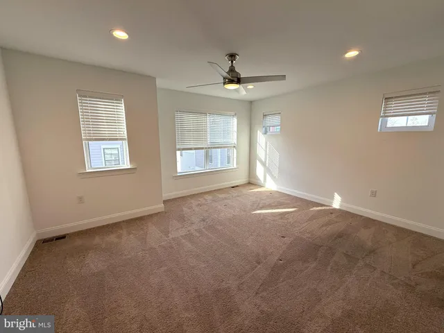 a spacious bathroom with a shower sink mirror and