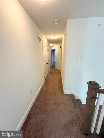 a utility room with a stove top oven