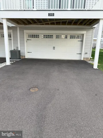 a view of a kitchen and wooden floor