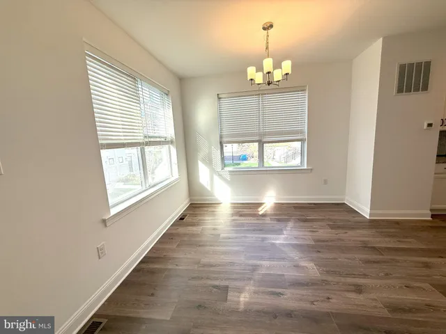 a large kitchen with a lot of counter space and appliances