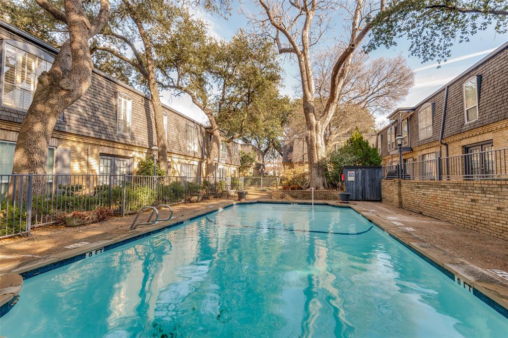 5033 Cedar Springs Road, Unit 103 Dallas, TX 75235 - Photo 10 of 12 a view of swimming pool with a yard