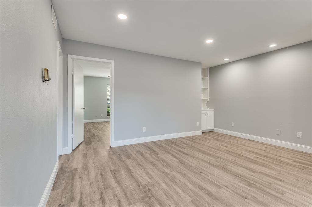 5033 Cedar Springs Road, Unit 103 Dallas, TX 75235 - Photo 5 of 12 wooden floor in an empty room with wooden floor