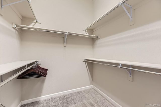 a living room with furniture a rug and a flat screen tv