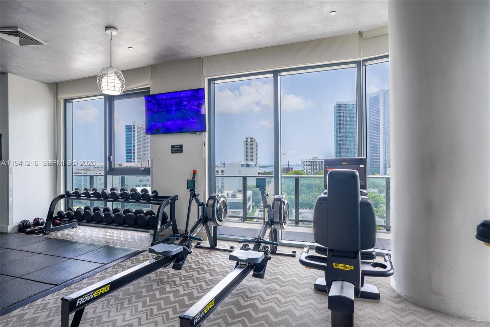 121 Northeast 34th Street, Unit 2711 Miami, FL 33137 - Photo 19 of 42 a view of a workspace with furniture