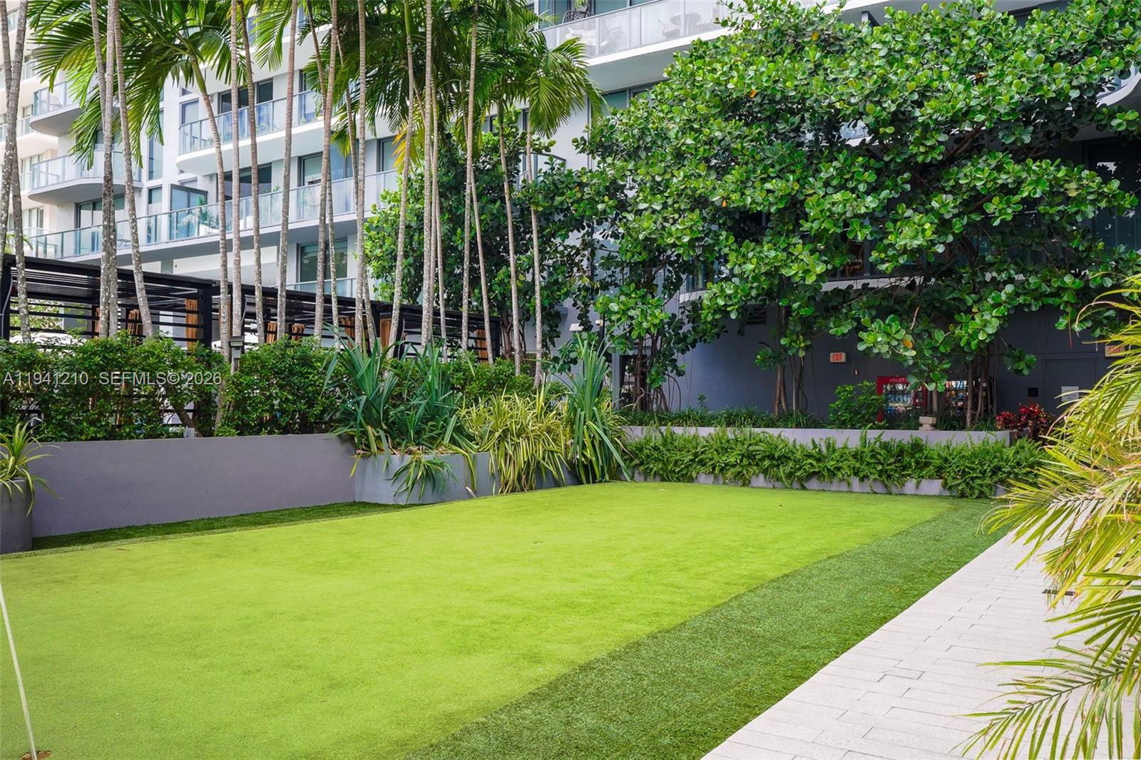 121 Northeast 34th Street, Unit 2711 Miami, FL 33137 - Photo 23 of 42 a view of building with yard