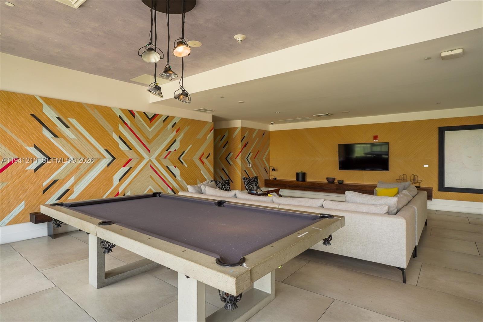 121 Northeast 34th Street, Unit 2711 Miami, FL 33137 - Photo 33 of 42 a room with table and chairs