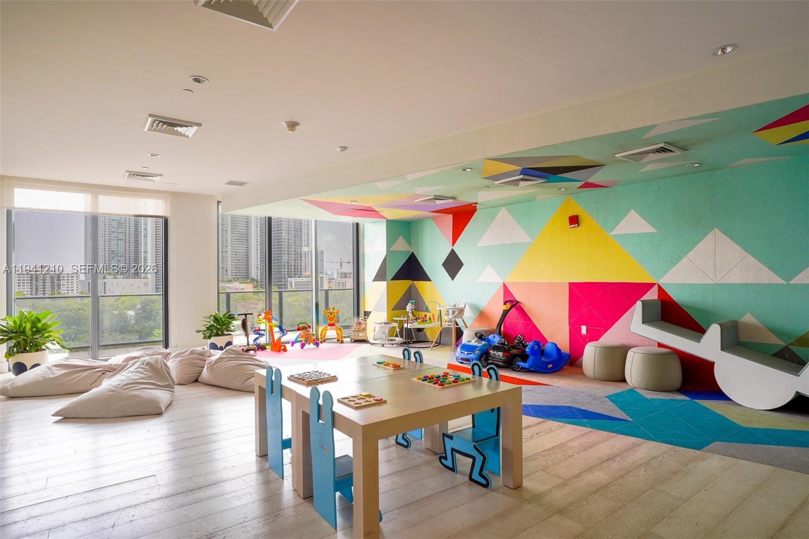 121 Northeast 34th Street, Unit 2711 Miami, FL 33137 - Photo 38 of 42 a group of people sitting at tables in a room