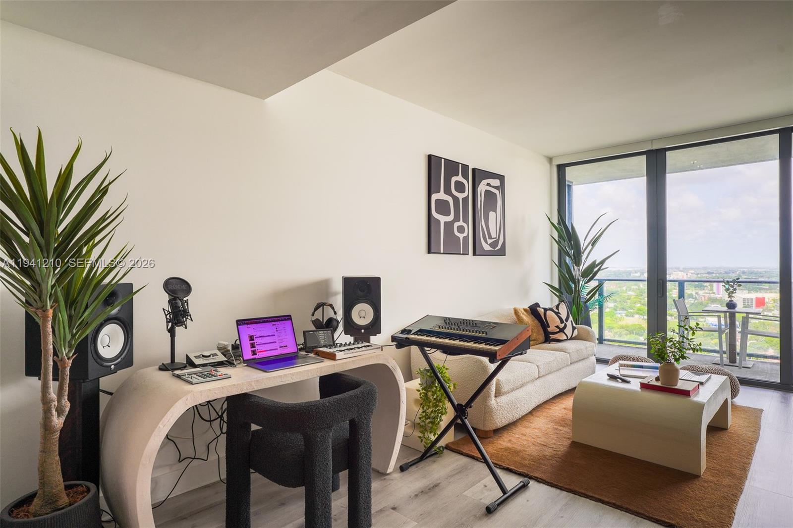 121 Northeast 34th Street, Unit 2711 Miami, FL 33137 - Photo 4 of 42 a view of a livingroom with furniture and lounge chair