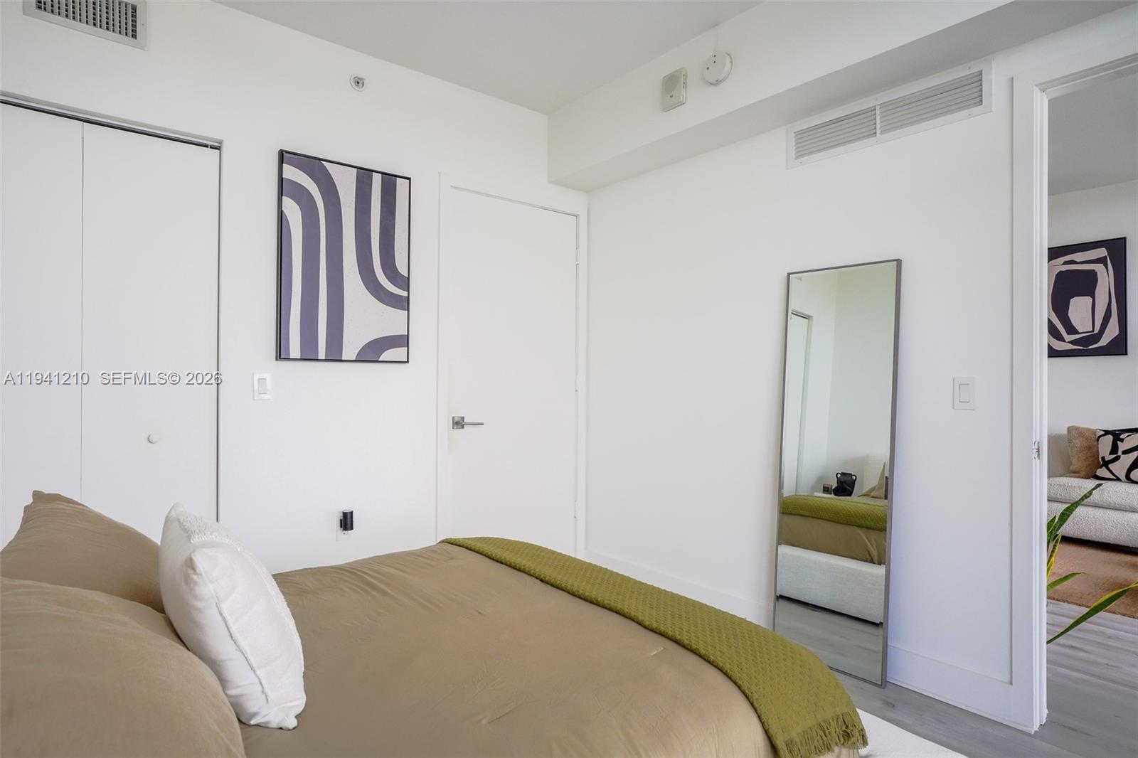 121 Northeast 34th Street, Unit 2711 Miami, FL 33137 - Photo 8 of 42 a bedroom with a bed and a window