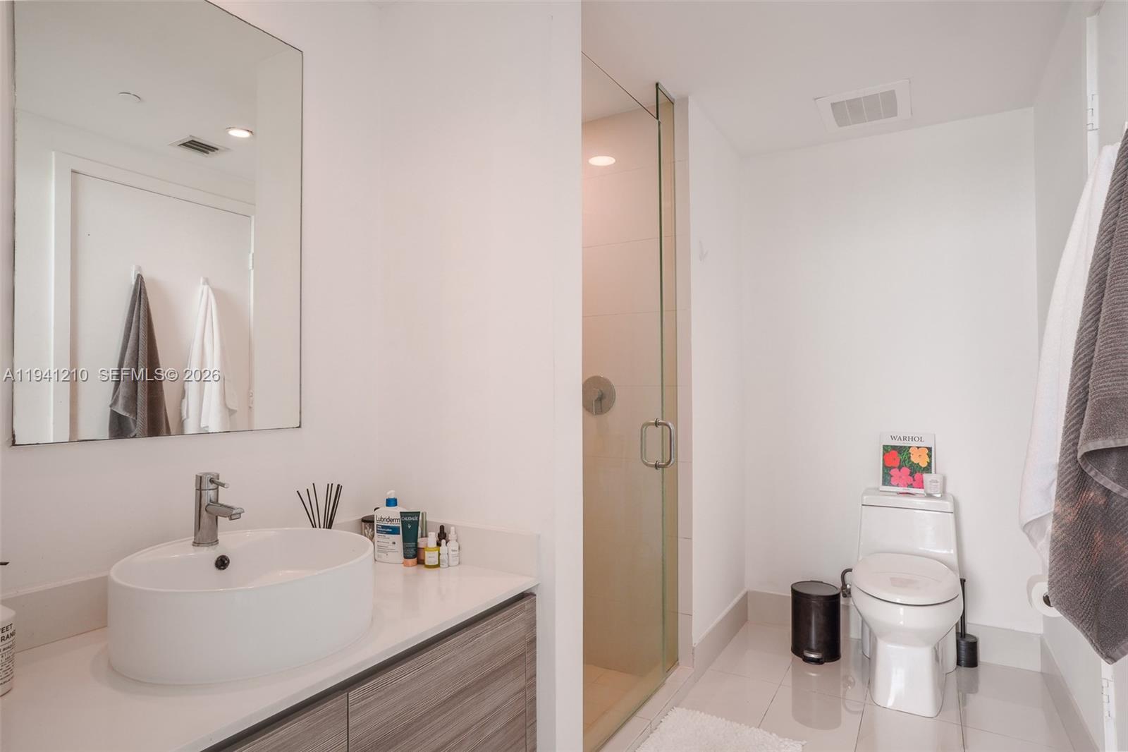121 Northeast 34th Street, Unit 2711 Miami, FL 33137 - Photo 10 of 42 a bathroom with a sink and a toilet