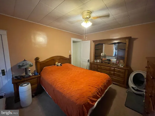 a bedroom with bed and window