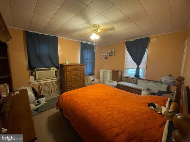 a bed room with a bed and furniture