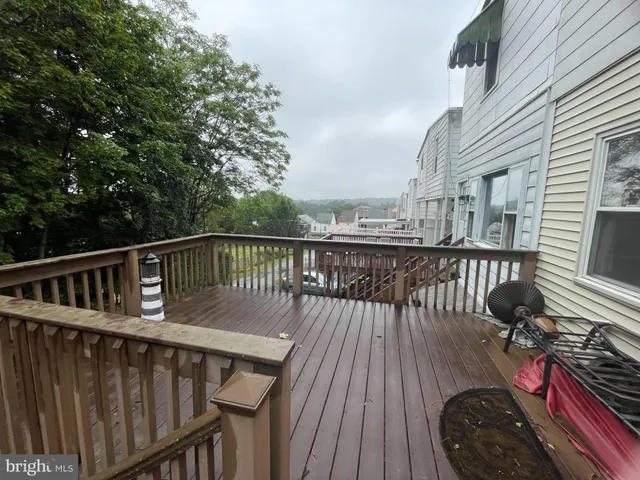 a view of balcony with deck and wooden floor