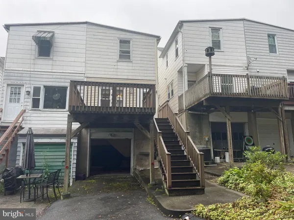 a front view of a house with stairs