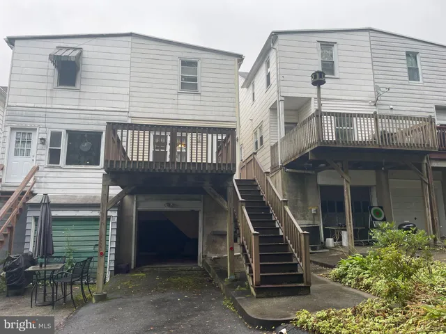 a front view of a house with stairs