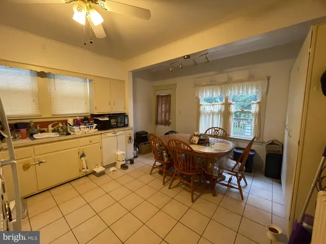 a view of a open dining room with furniture