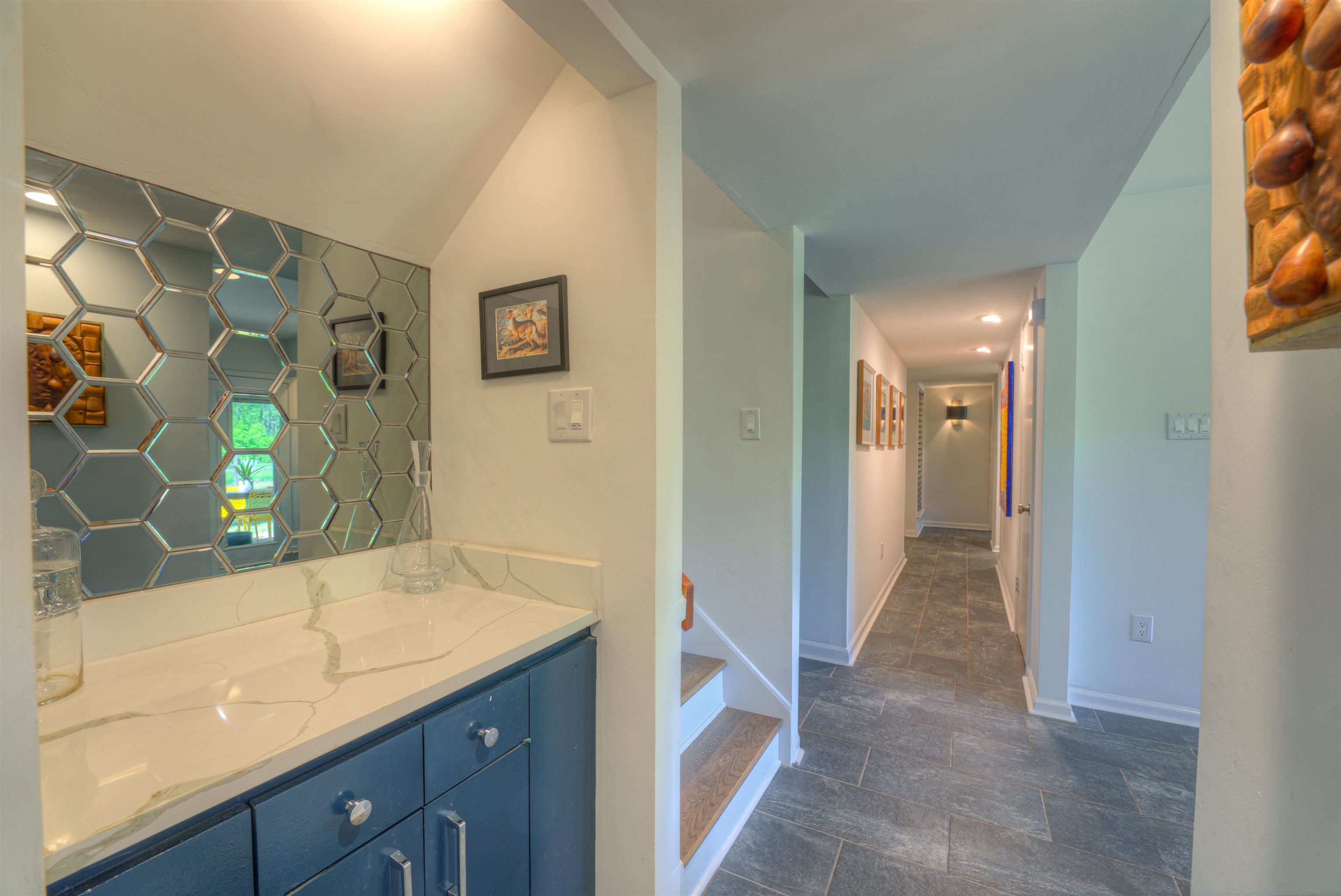 6921 Tangleberry Cove Memphis, TN 38119 - Photo 10 of 39 a view of hallway with bathroom and mirror