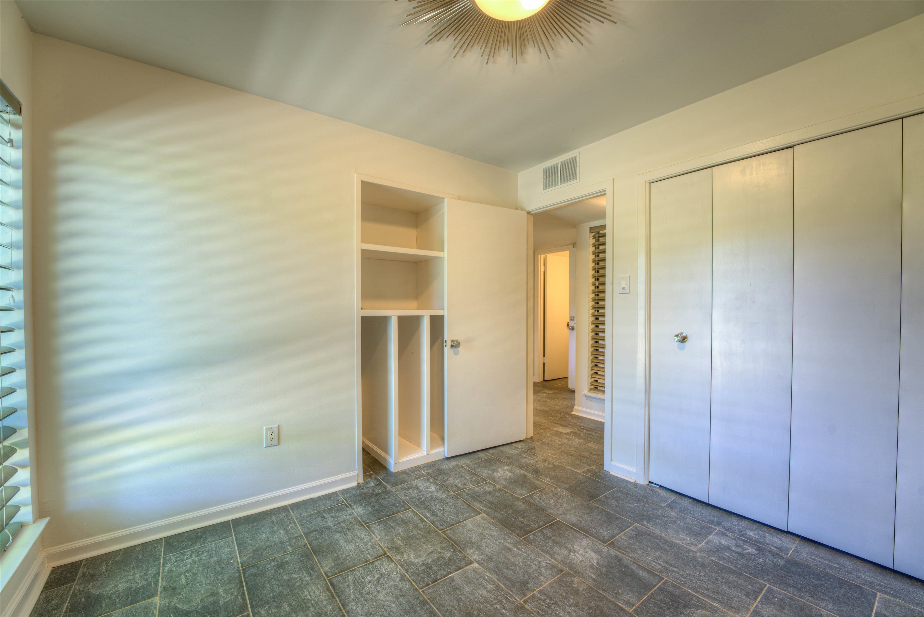 6921 Tangleberry Cove Memphis, TN 38119 - Photo 13 of 39 a view of an empty room and window