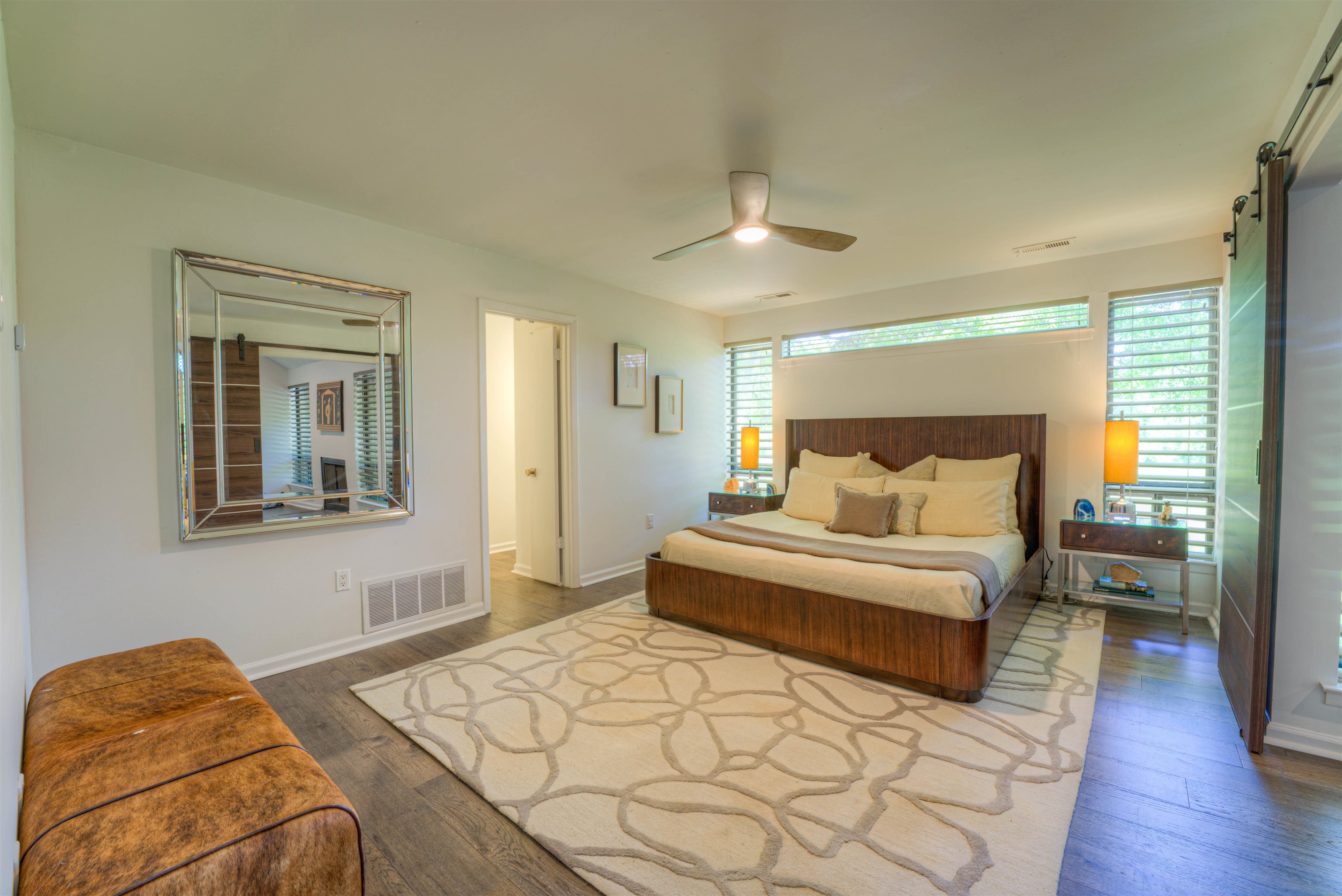 6921 Tangleberry Cove Memphis, TN 38119 - Photo 17 of 39 a bedroom with a bed couches and wooden floor