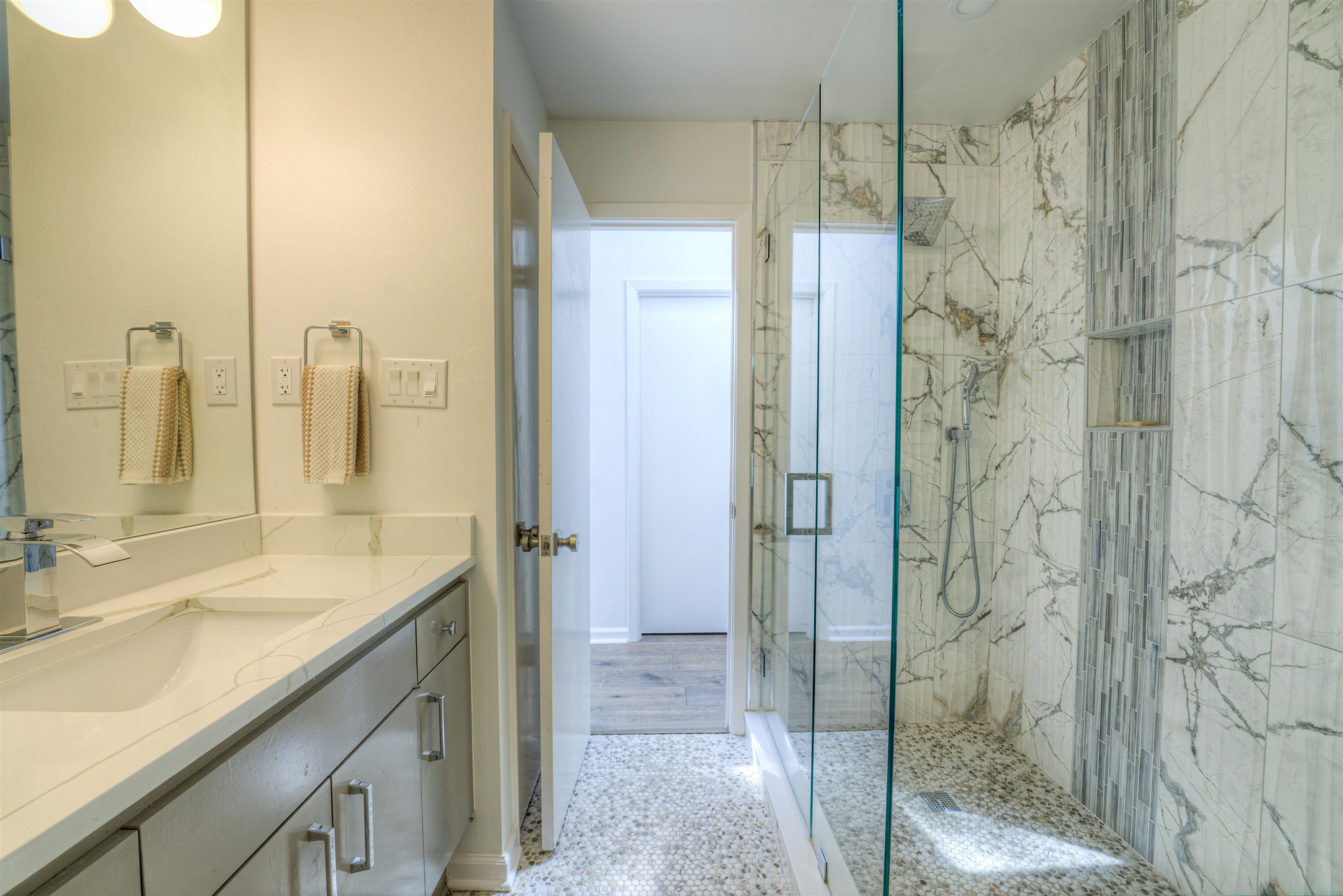 6921 Tangleberry Cove Memphis, TN 38119 - Photo 21 of 39 a bathroom with a granite countertop sink shower and a mirror