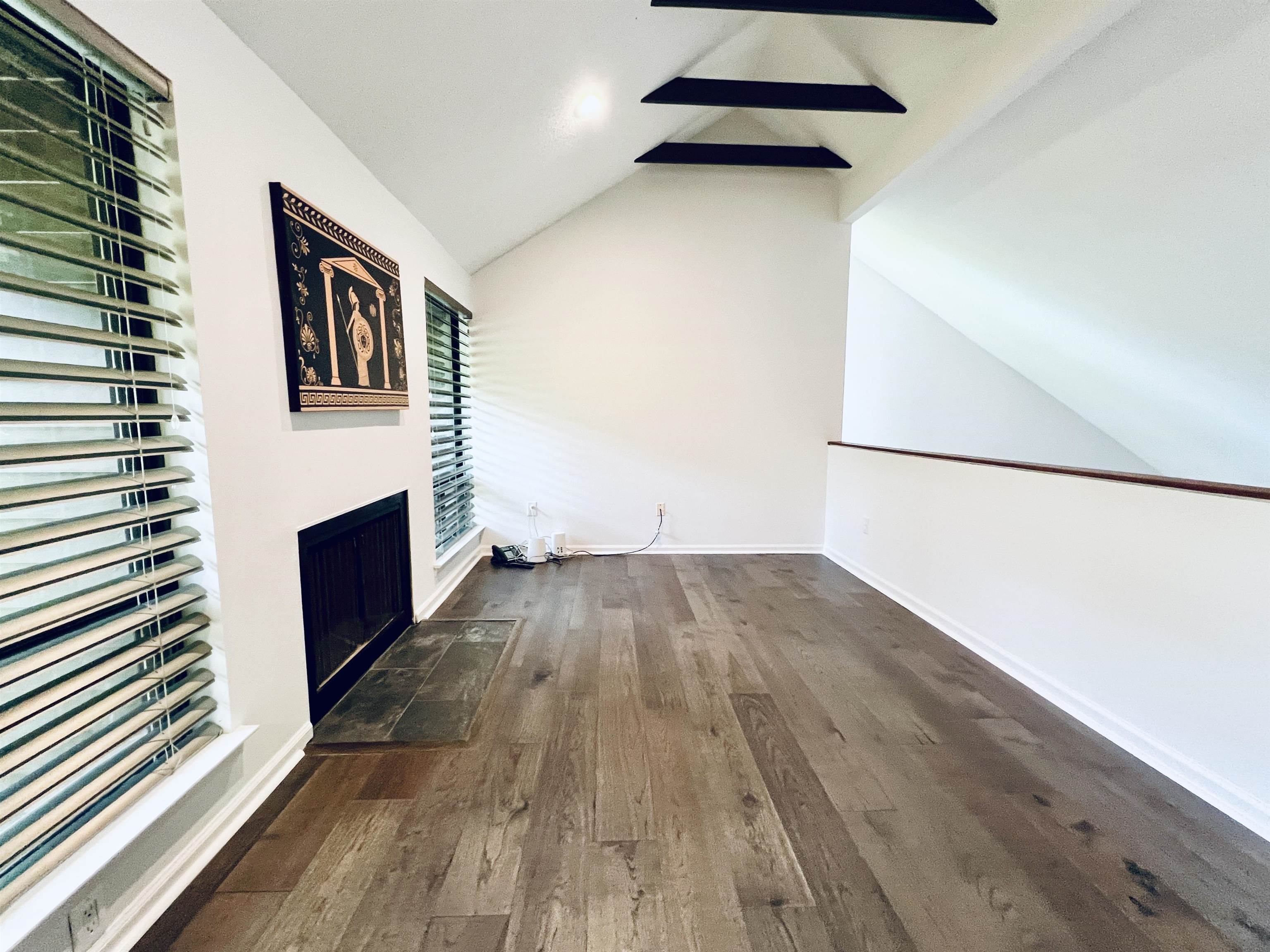 6921 Tangleberry Cove Memphis, TN 38119 - Photo 23 of 39 a view of a livingroom with wooden floor and staircase