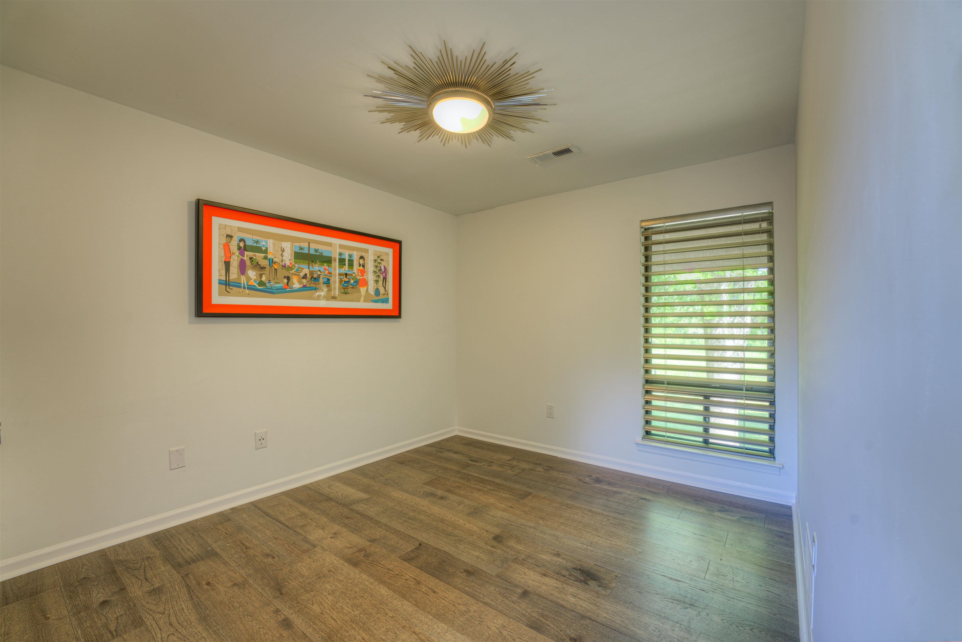 6921 Tangleberry Cove Memphis, TN 38119 - Photo 26 of 39 a view of empty room with wooden floor and fan