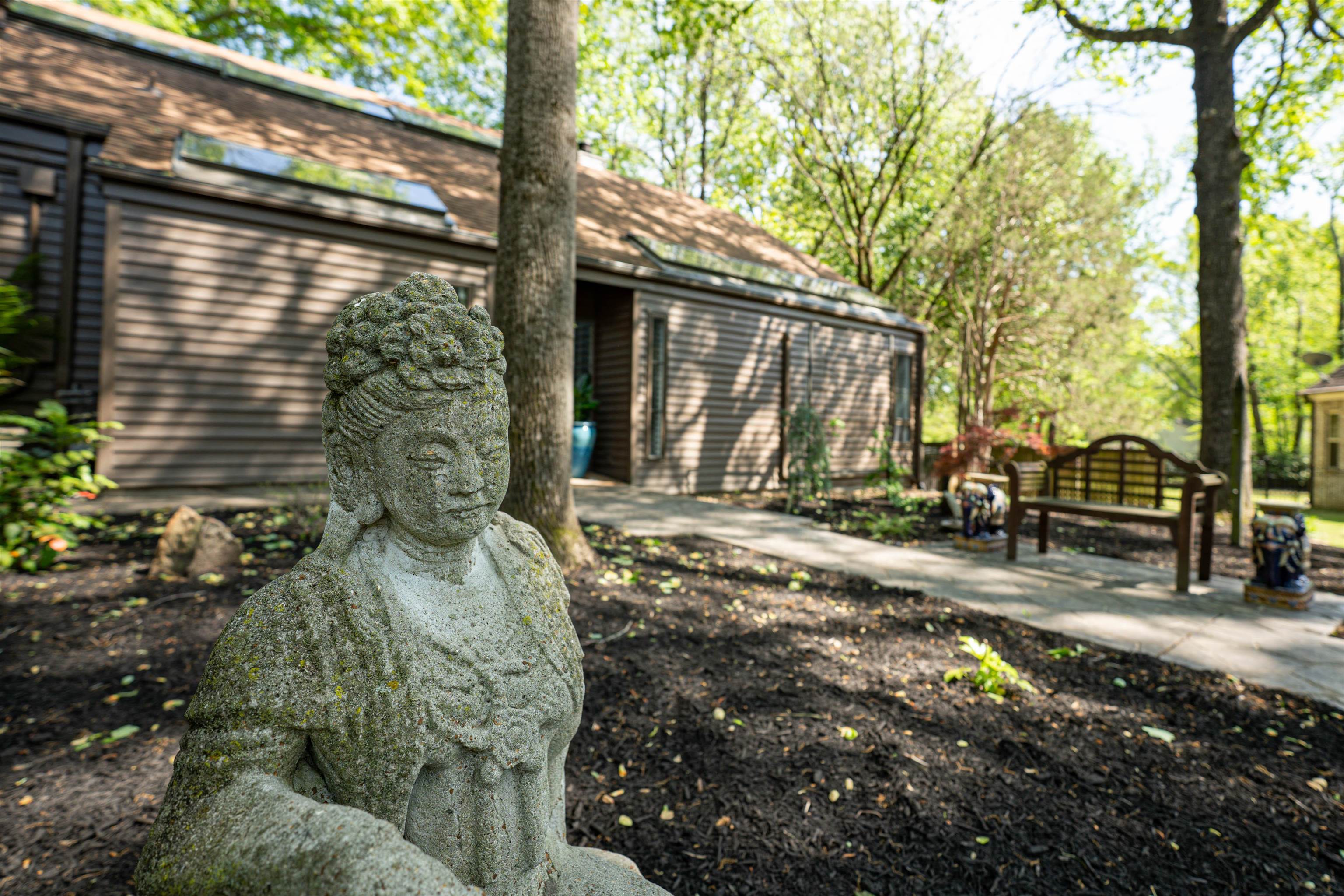 6921 Tangleberry Cove Memphis, TN 38119 - Photo 35 of 39 a view of a house with a yard siting area and garden