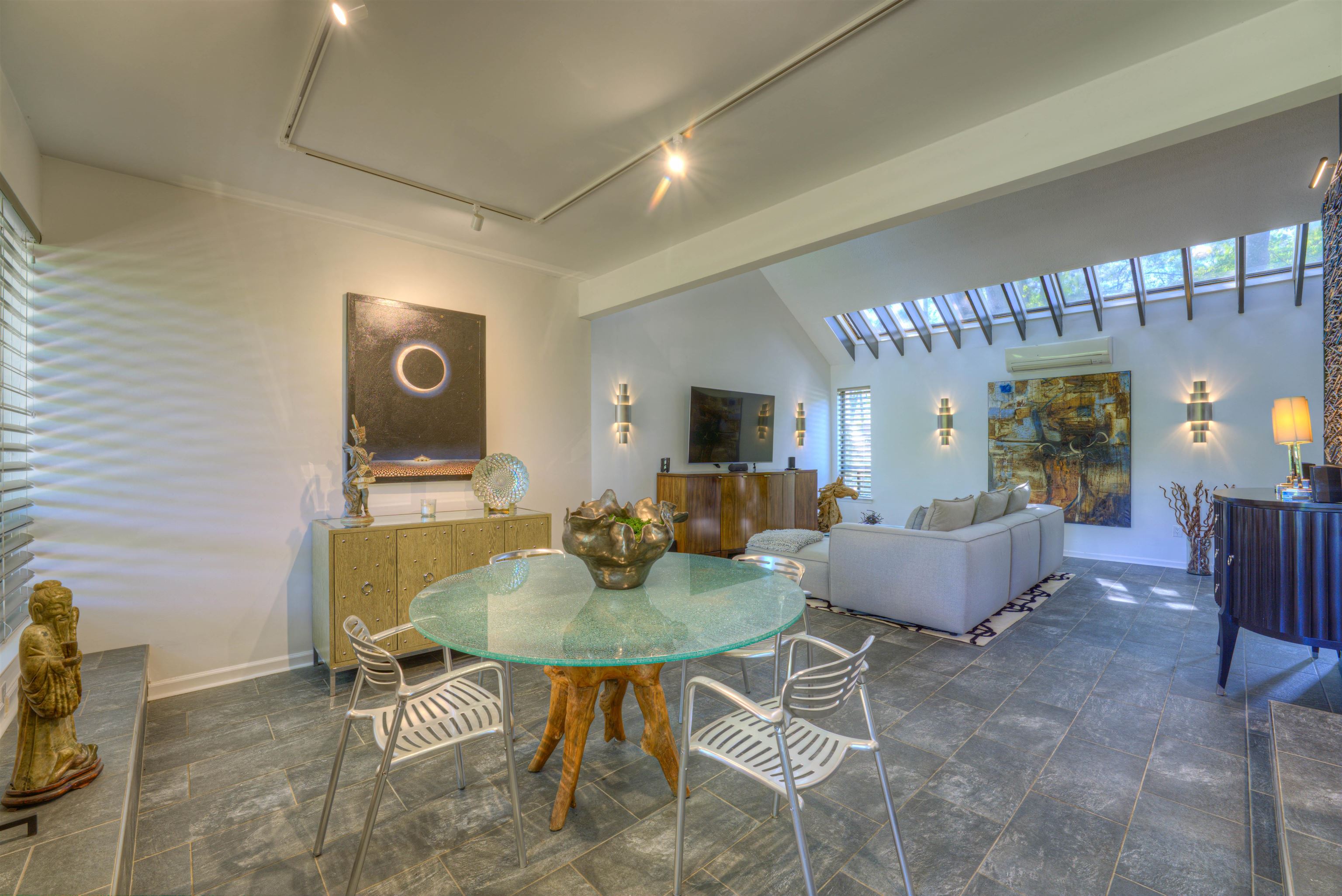 6921 Tangleberry Cove Memphis, TN 38119 - Photo 6 of 39 a living room with couches a coffee table and a dining table with kitchen view