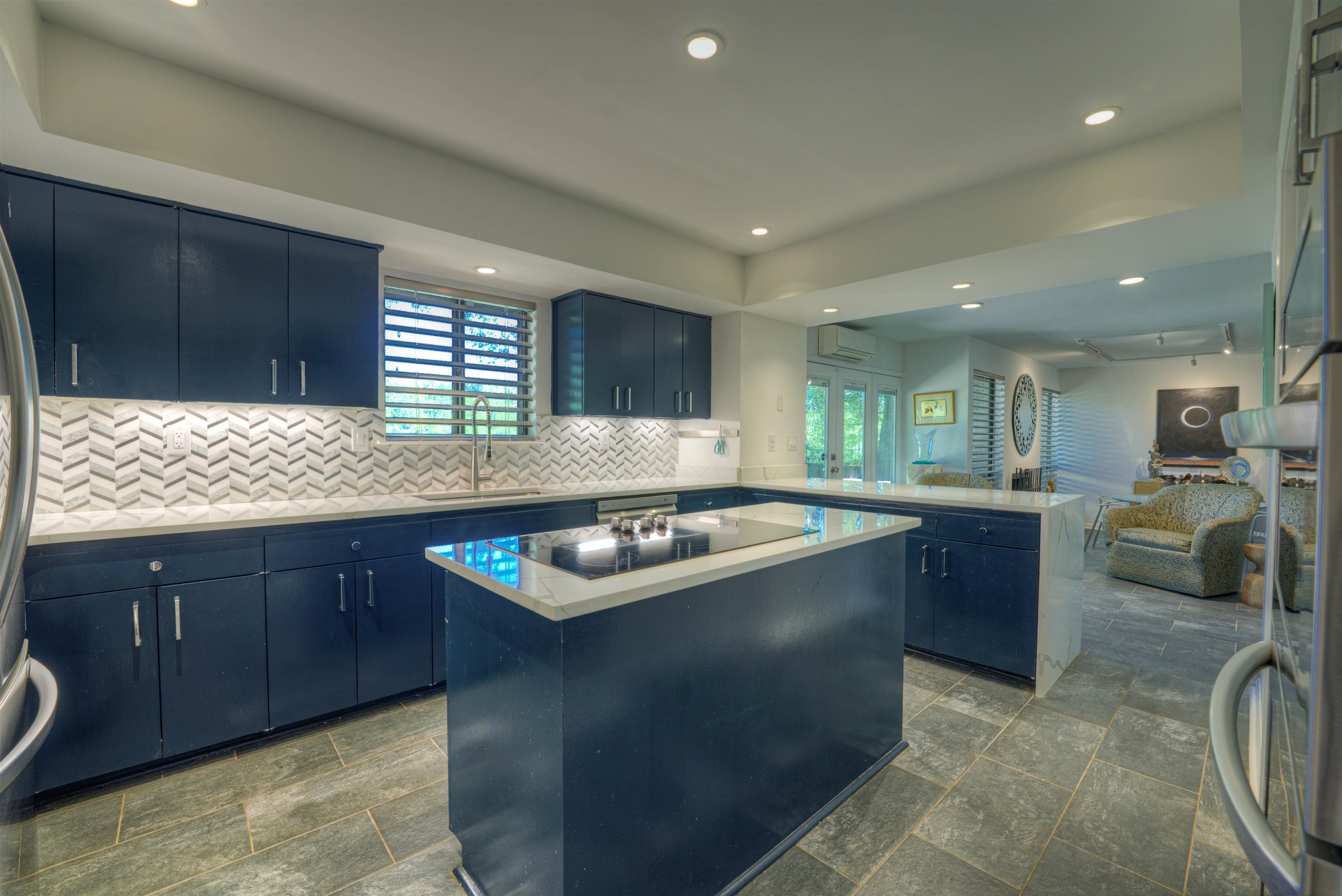 6921 Tangleberry Cove Memphis, TN 38119 - Photo 37 of 39 a kitchen with kitchen island granite countertop a sink counter top space and appliances