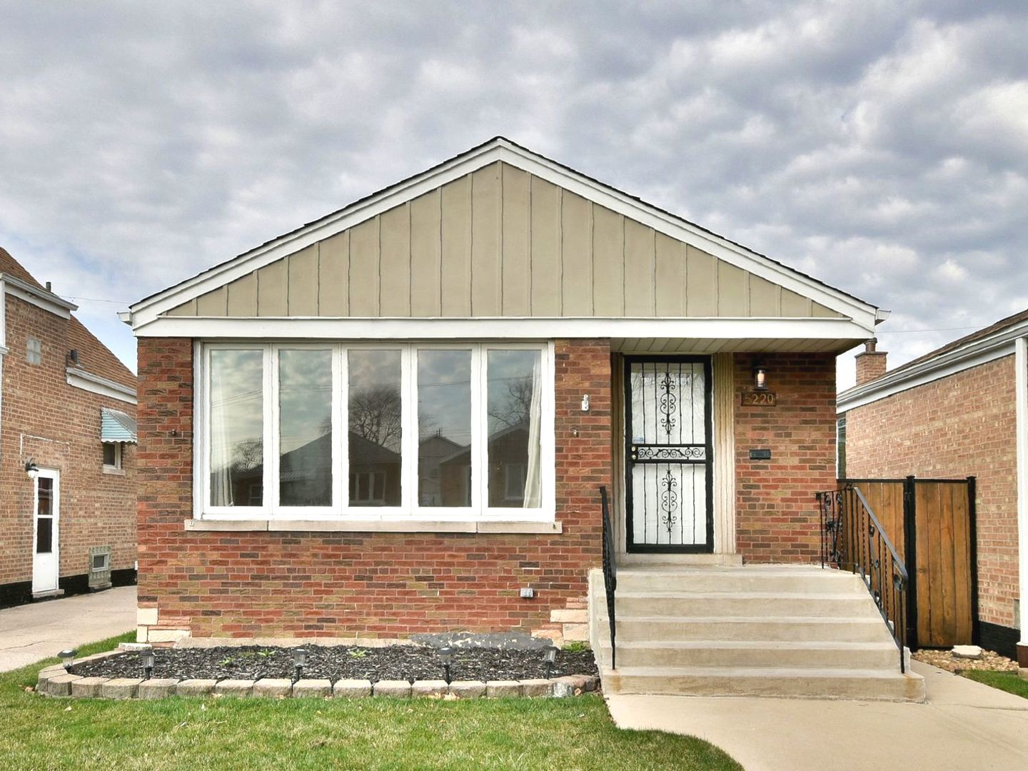 5220 South Rutherford Avenue Chicago, IL 60638 - Photo 1 of 18 a front view of a house with a yard