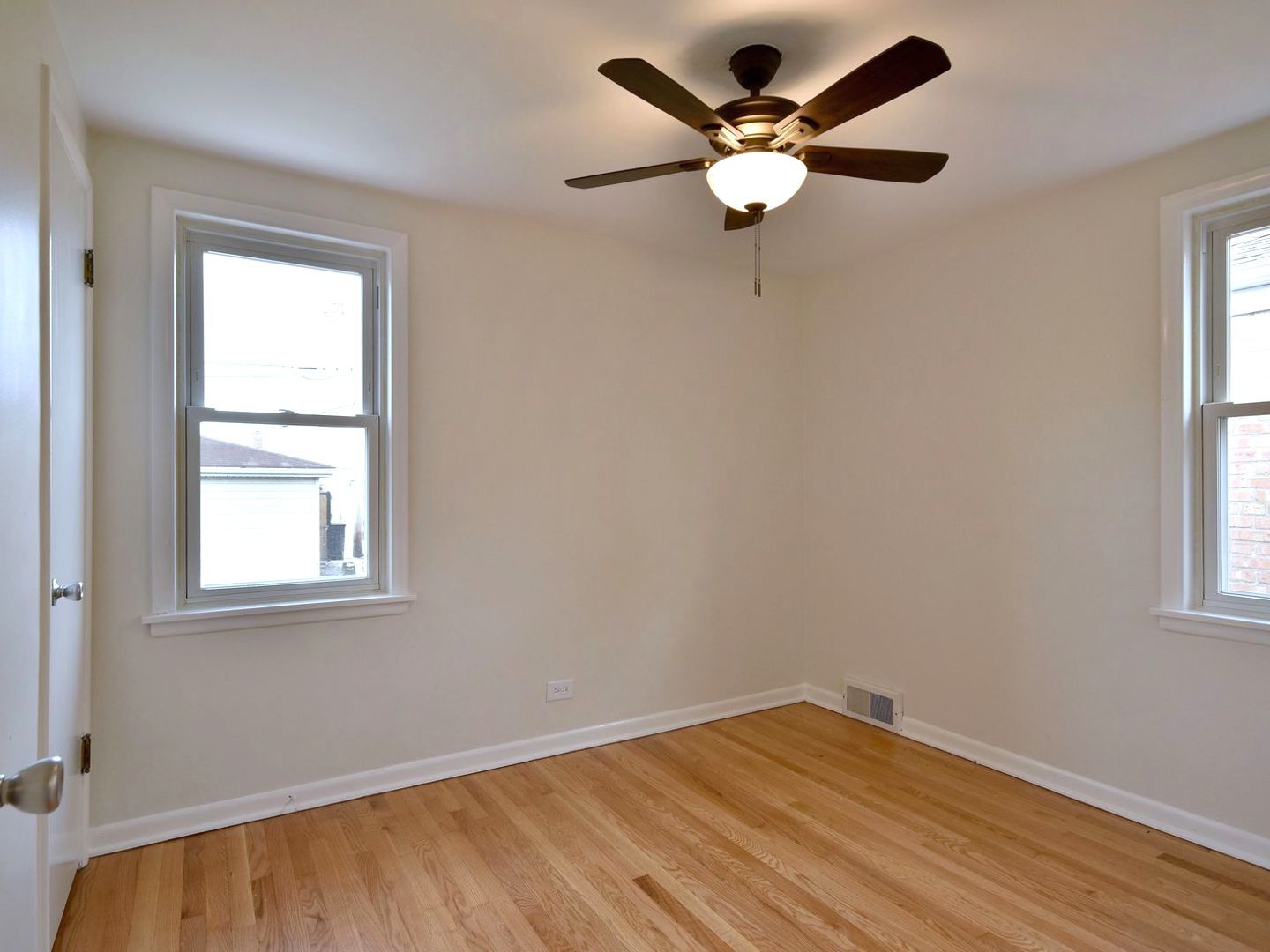 5220 South Rutherford Avenue Chicago, IL 60638 - Photo 12 of 18 an empty room with window and ceiling fan